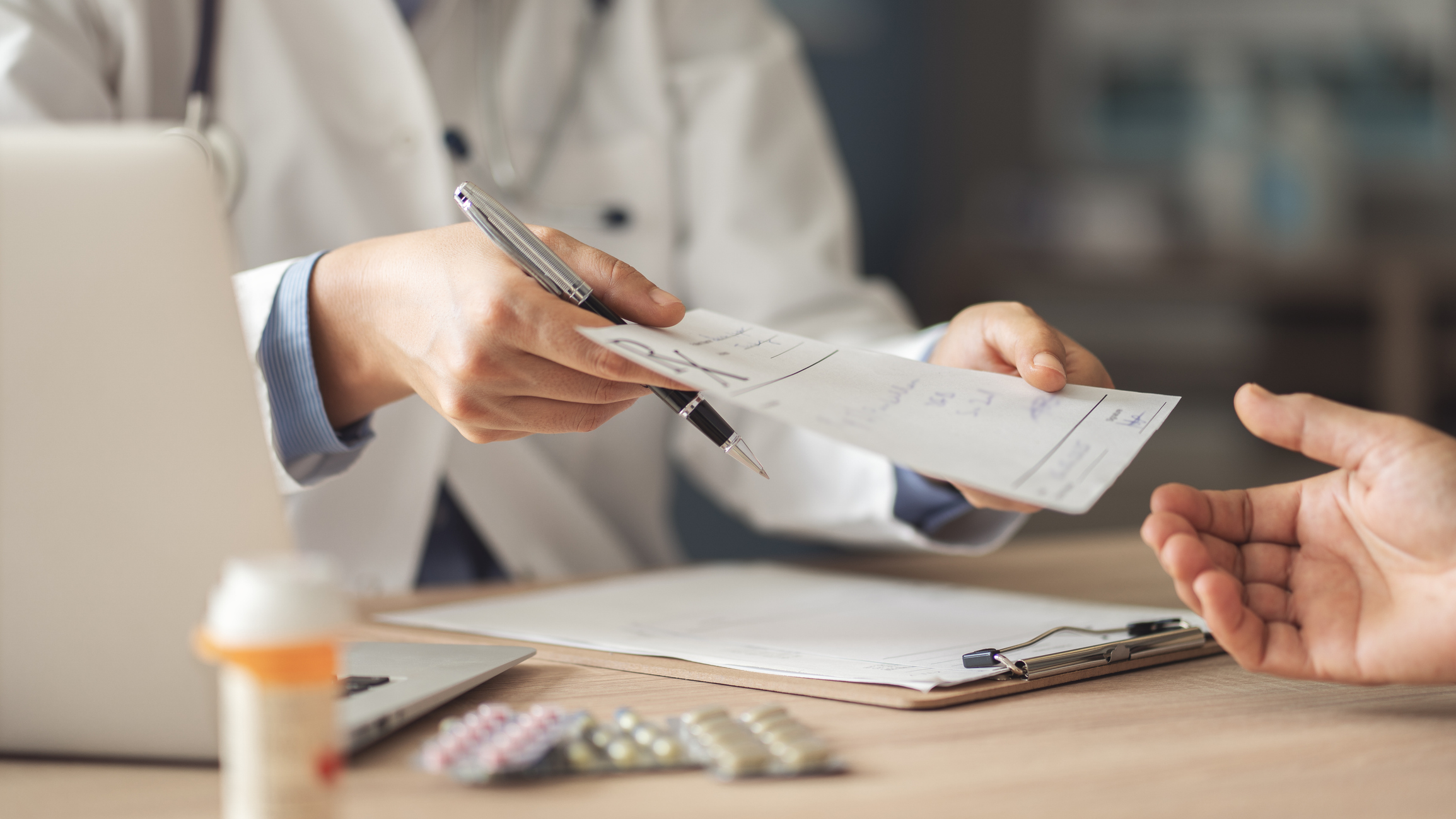 doctor giving patient prescription